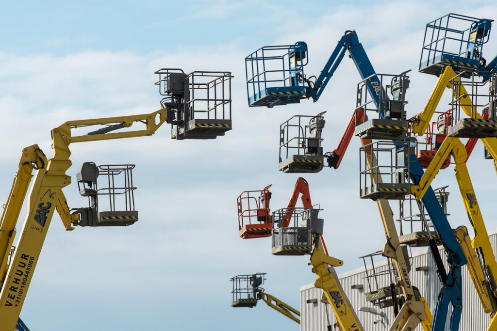Boom lifts and scissor lifts on construction site